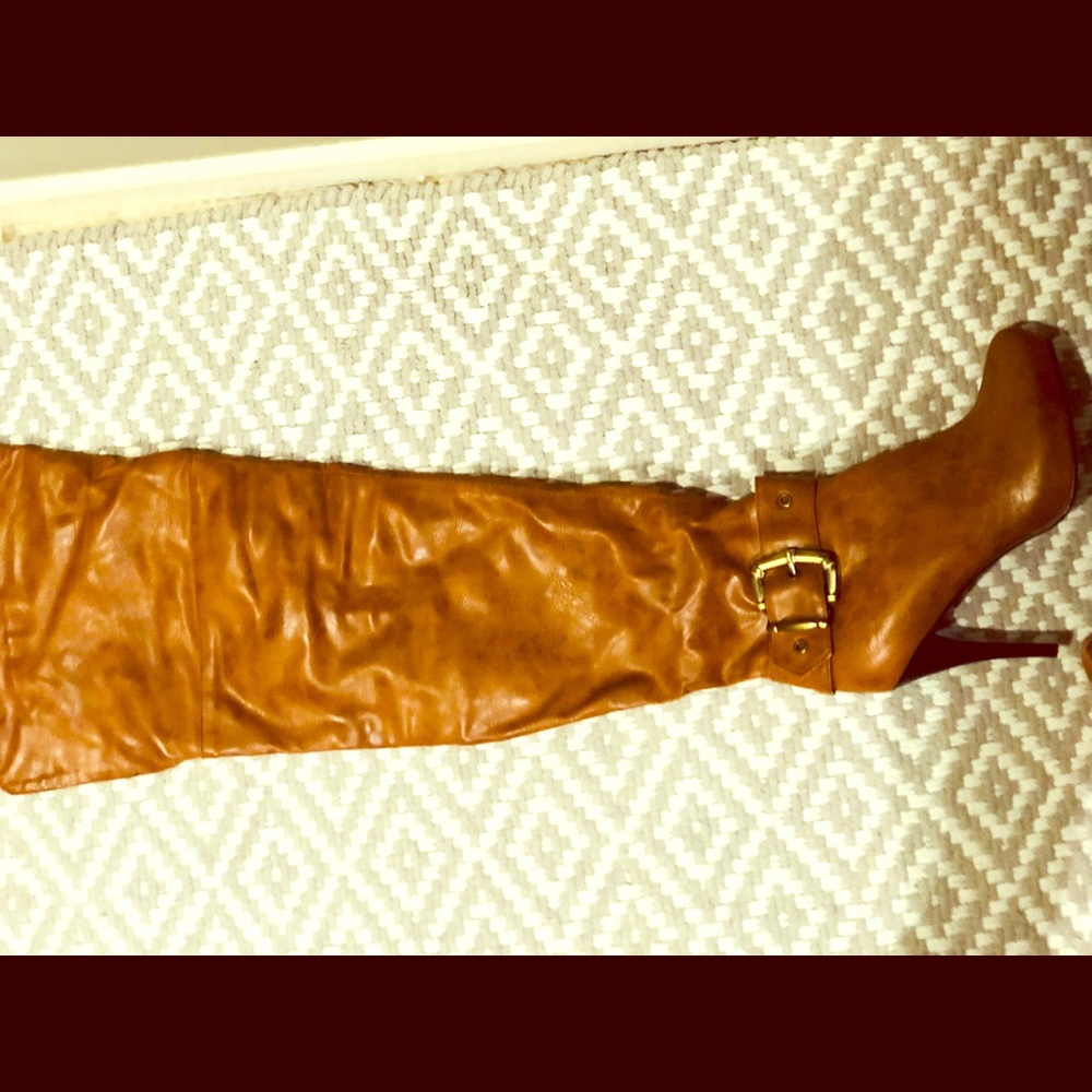Tan Thigh high boots.